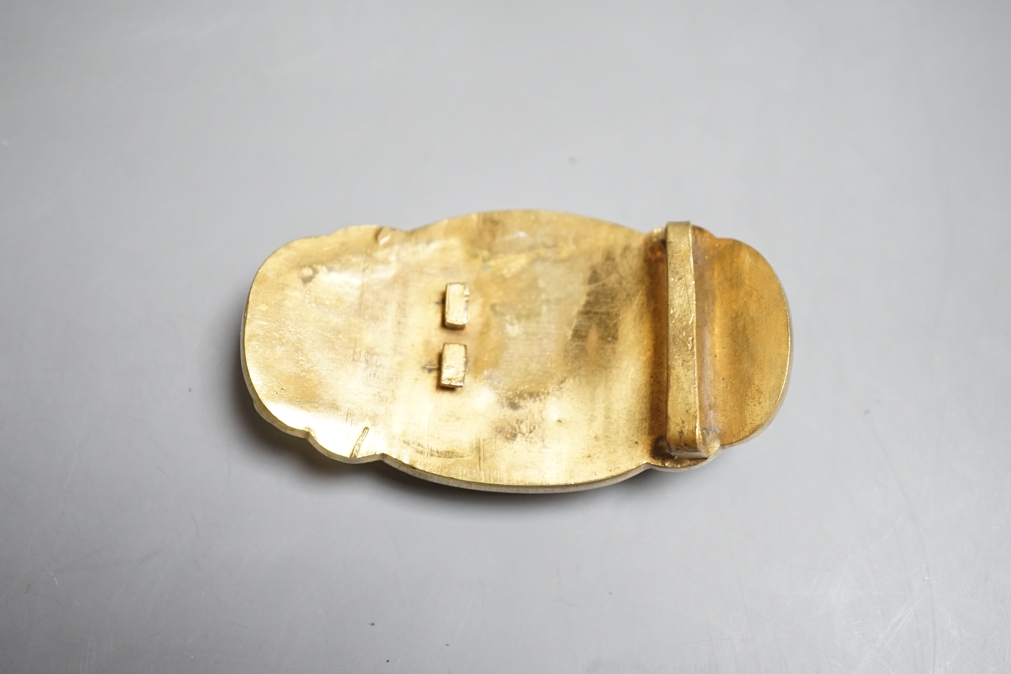 A Chinese jade and hardstone mounted belt buckle, late 19th/early 20th century 8.5cm wide